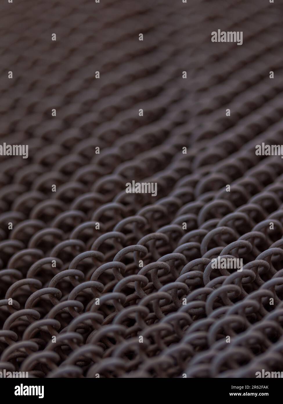 Background of the metal chain-link fence. Close-up. Stock Photo