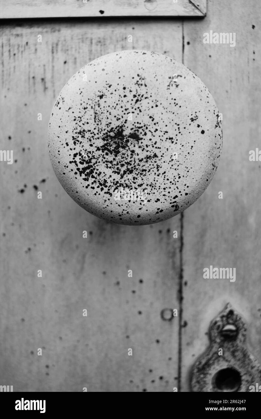 Simple round doorknob made out of copper metal in a black and white monochrome Stock Photo Alamy