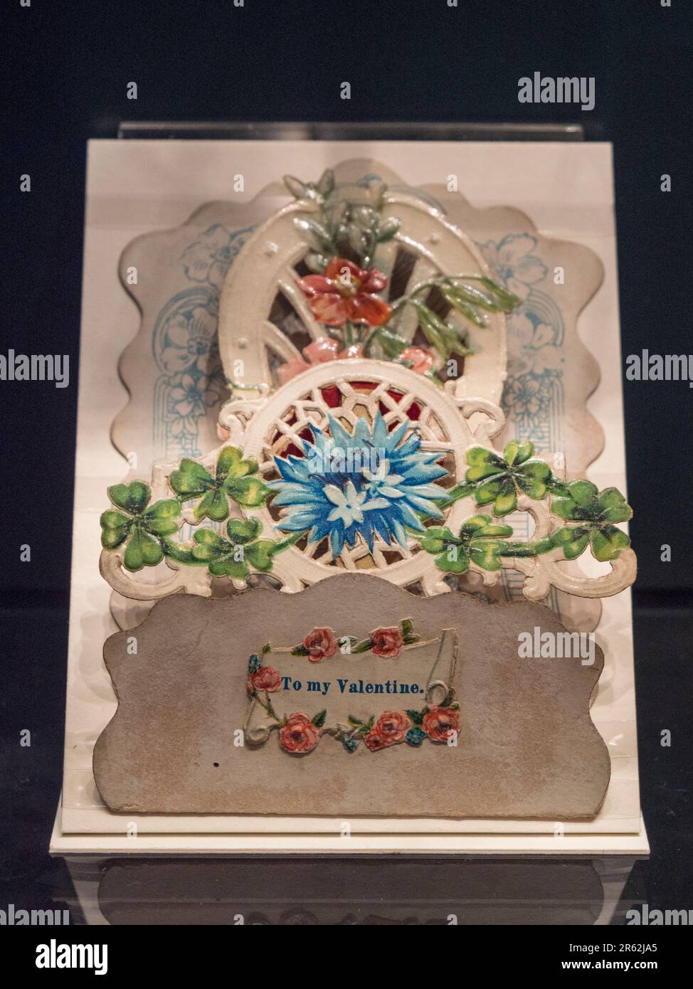 An early Valentine card with flowers and foliage on display in the Postal Museum in London, UK. Stock Photo