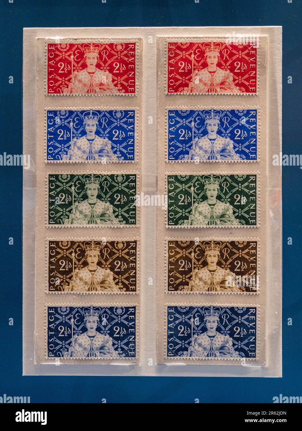 Coronation stamps with a portrait by Edmund Dulac for Queen Elizabeth II on display in the Postal Museum in London, UK. Stock Photo
