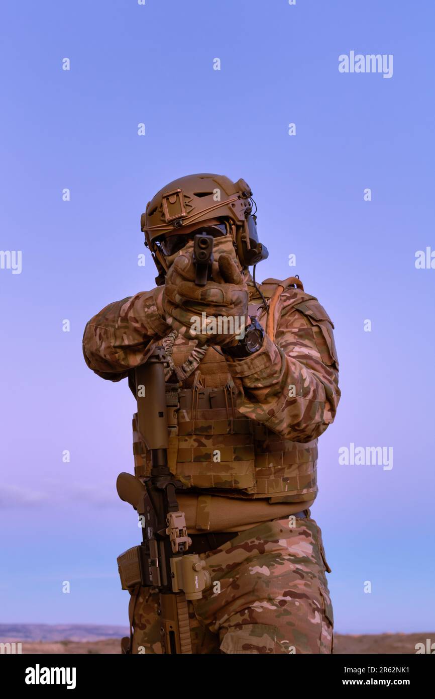 Modern Rifles Uniform A man wearing a military uniform with a rifle Stock Photo - Alamy