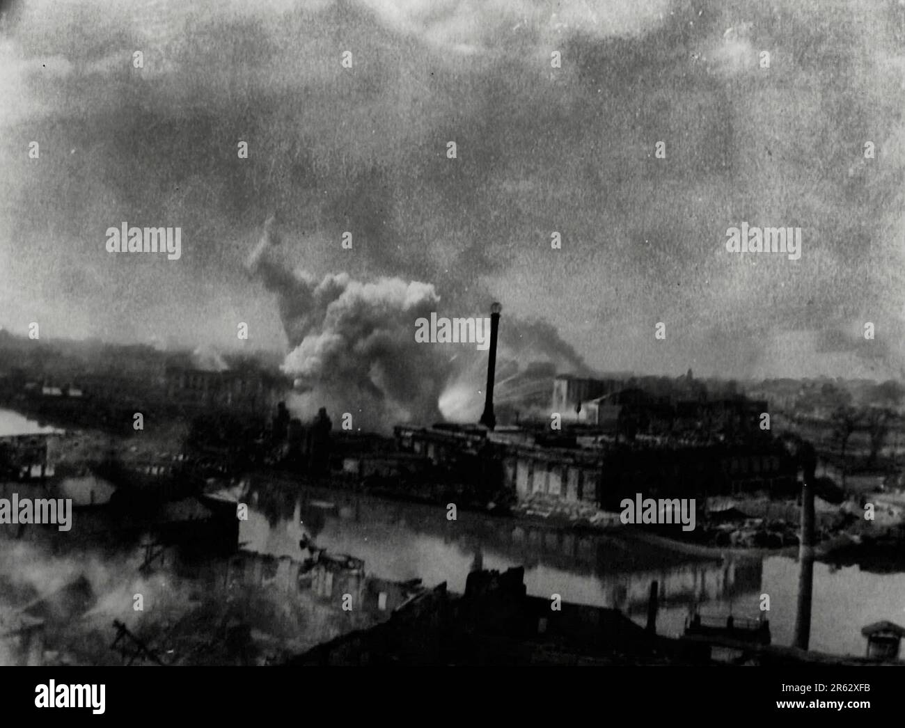 The walled city of Intramurros, built by the Spanish many years ago, will be the final battle ground in the battle of Manila, because it contains an untold number of Japanese soldiers who are prepared to fight to the bitter end. Here are the Metropolitan Theater and the ice house taking a terrific shelling from 155mm long guns, February 1945 Stock Photo