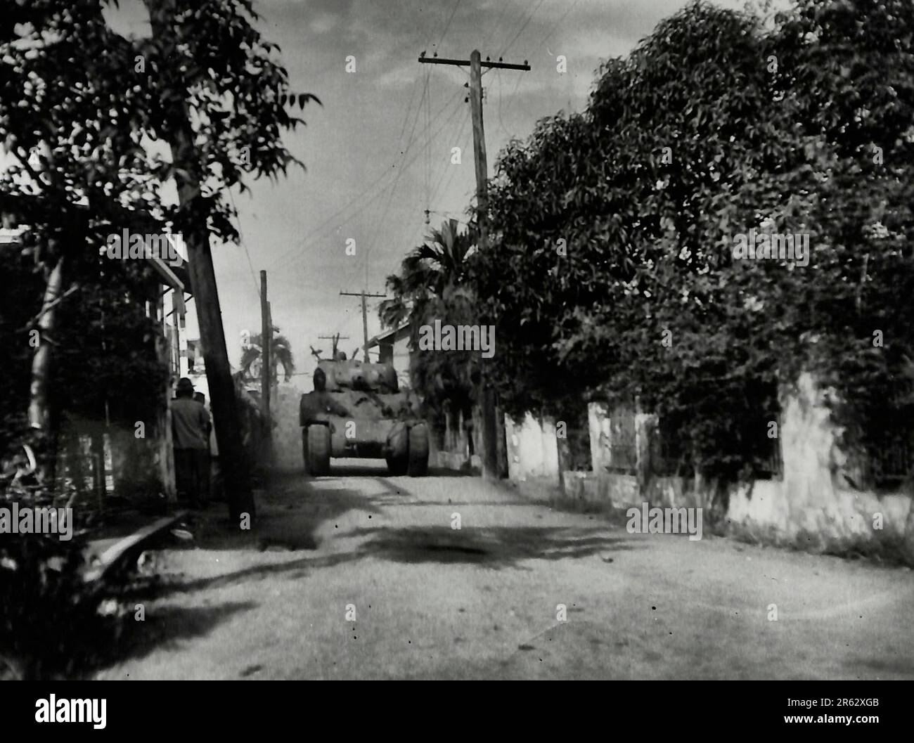 Tanks of the 1st Cavalry move up into position in offensive to the Japanese holding Rizal Stadium and who are blocking the south flank of the bay and the route to the Walled City of Intramurros which should decide the Battle for Manila, Philippines. February 1945 Stock Photo