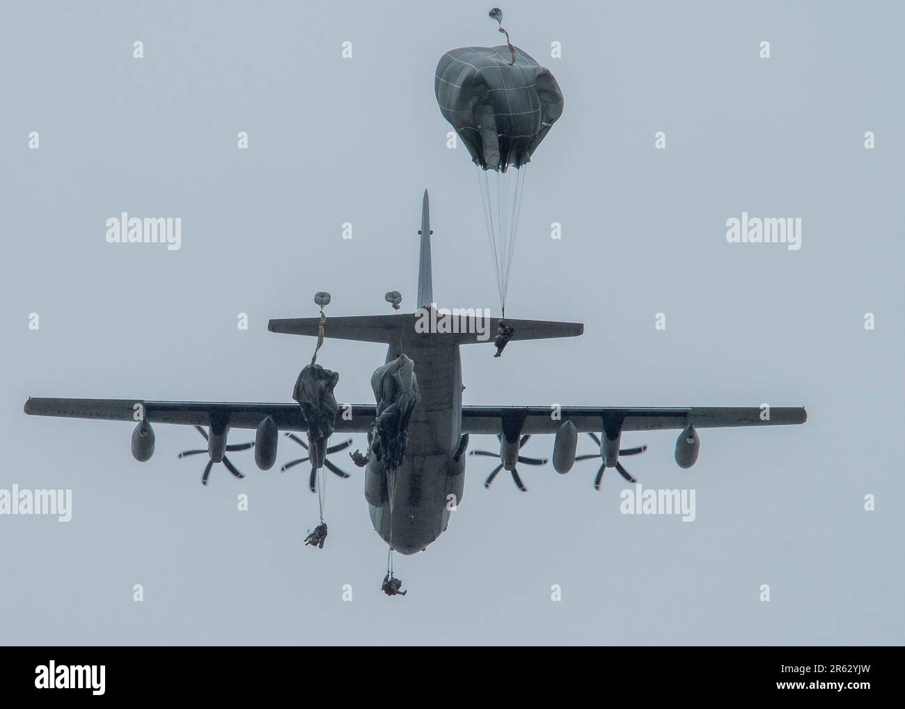 After exiting a U.S. Marine Corps KC-130J assigned to the Marine Aerial Refueler Transport Squadron (VGMR) 153, Marine Corps Air Station Kaneohe Bay, Hawaii, U.S. Army paratroopers assigned to the 3rd Battalion, 509th Parachute Infantry Regiment, 2nd Infantry Brigade Combat Team (Airborne), 11th Airborne Division, parachute onto the Malemute Drop Zone at Joint Base Elmendorf-Richardson, Alaska, May 31, 2023. Paratroopers assigned to the 1st Battalion, 509th Infantry Regiment at Fort Polk, Louisiana, joined members from the 3-509th on their jump to celebrate the donation of items worn by World Stock Photo