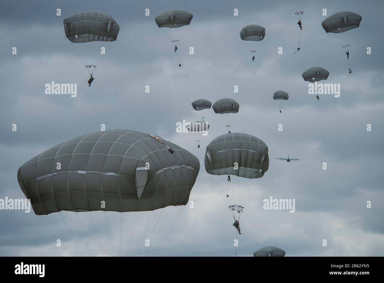 After exiting a U.S. Marine Corps KC-130J assigned to the Marine Aerial Refueler Transport Squadron (VGMR) 153, Marine Corps Air Station Kaneohe Bay, Hawaii, U.S. Army paratroopers assigned to the 3rd Battalion, 509th Parachute Infantry Regiment, 2nd Infantry Brigade Combat Team (Airborne), 11th Airborne Division, parachute onto the Malemute Drop Zone at Joint Base Elmendorf-Richardson, Alaska, May 31, 2023. Paratroopers assigned to the 1st Battalion, 509th Infantry Regiment at Fort Polk, Louisiana, joined members from the 3-509th on their jump to celebrate the donation of items worn by World Stock Photo