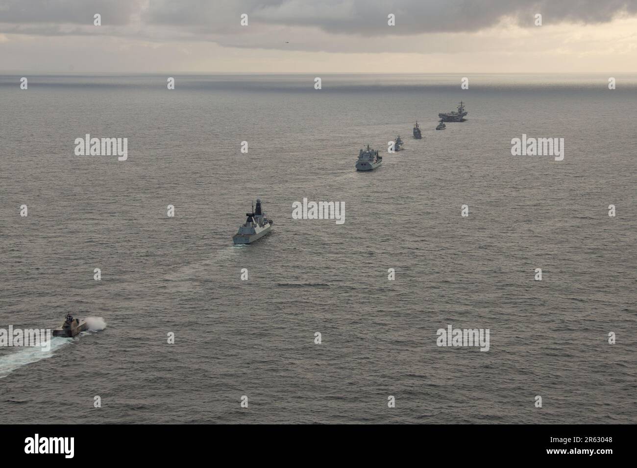 The Gerald R. Ford Carrier Strike Group sails in formation with NATO allied ships during an integrated sailing event, June 5, 2023. The ships sailing include the worldÕs largest aircraft carrier USS Gerald R. Ford (CVN 78), British Royal Navy Type 23 Frigate HMS Northumberland (F238), Ticonderoga-class guided missile cruiser USS Normandy (CG 60), Royal Norwegian Navy Fridjof Nansen-class Frigate HNoMS Otto Sverdrup (F312), British Royal Fleet Auxiliary Tide-class tanker RFA Tidespring (A136), Daring-class air defense destroyer HMS Defender (D36) and Royal Norwegian Navy Skjold-class corvette H Stock Photo