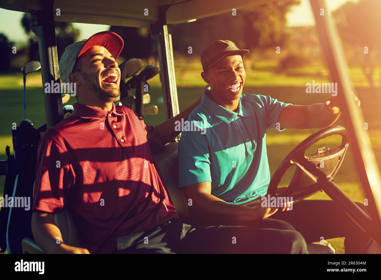 Double Course This is how we roll. two golfers riding in a cart on a golf course ...