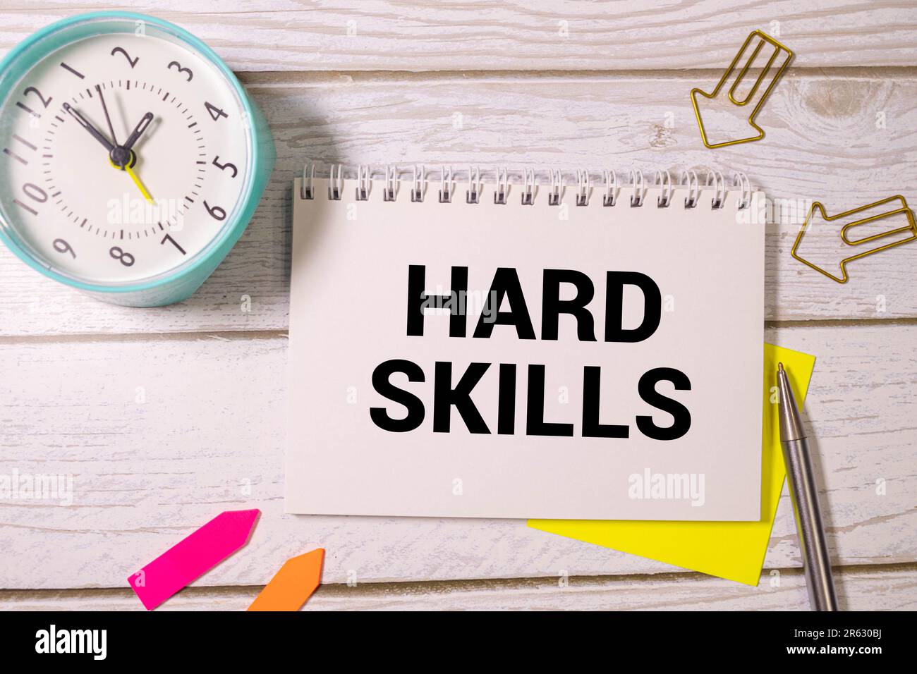 Motivational words: HARD SKILLS. Man holds a piece of paper with the text: HARD SKILLS. Business and finance concept Stock Photo