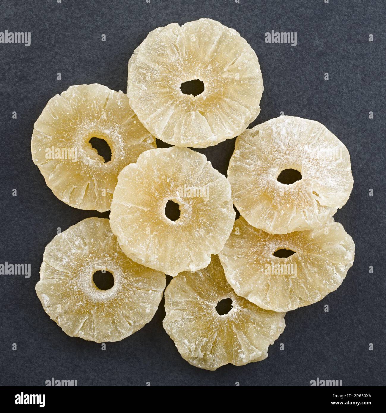 Dried candied pineapple slices photographed overhead on slate Stock Photo Alamy