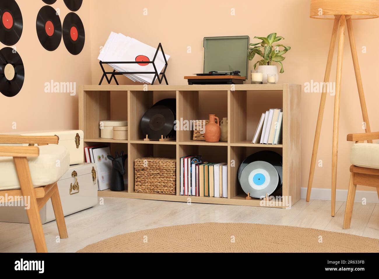 Vinyl record player on wooden shelving unit indoors Stock Photo Alamy