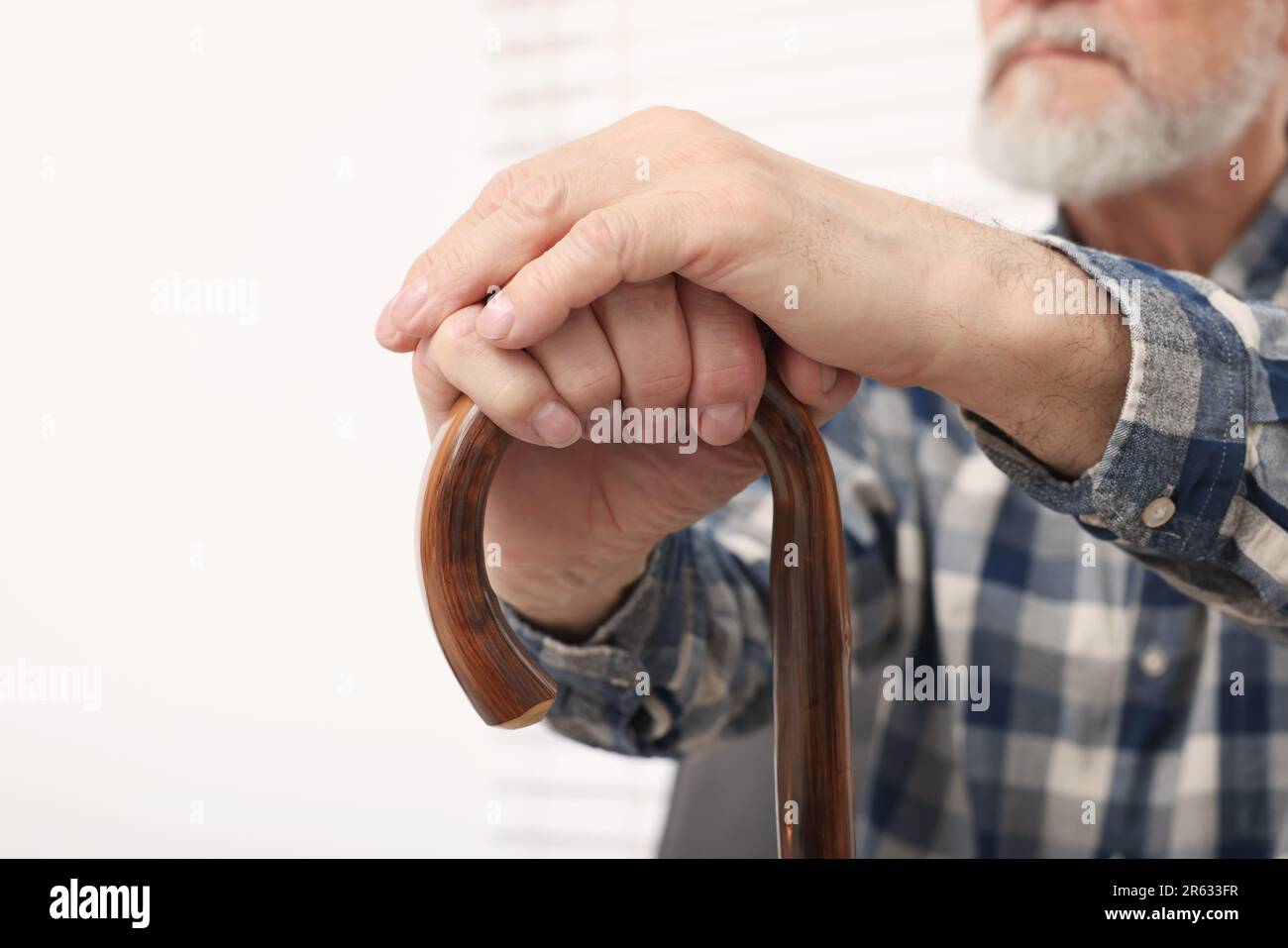 Senior man with walking cane at home, closeup. Space for text Stock ...