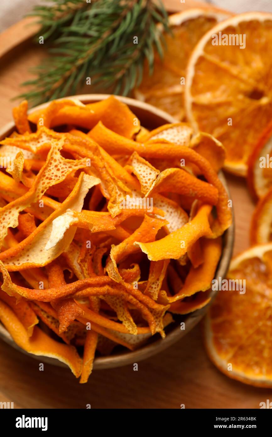 Dry orange peels and slices on wooden board, above view Stock Photo - Alamy