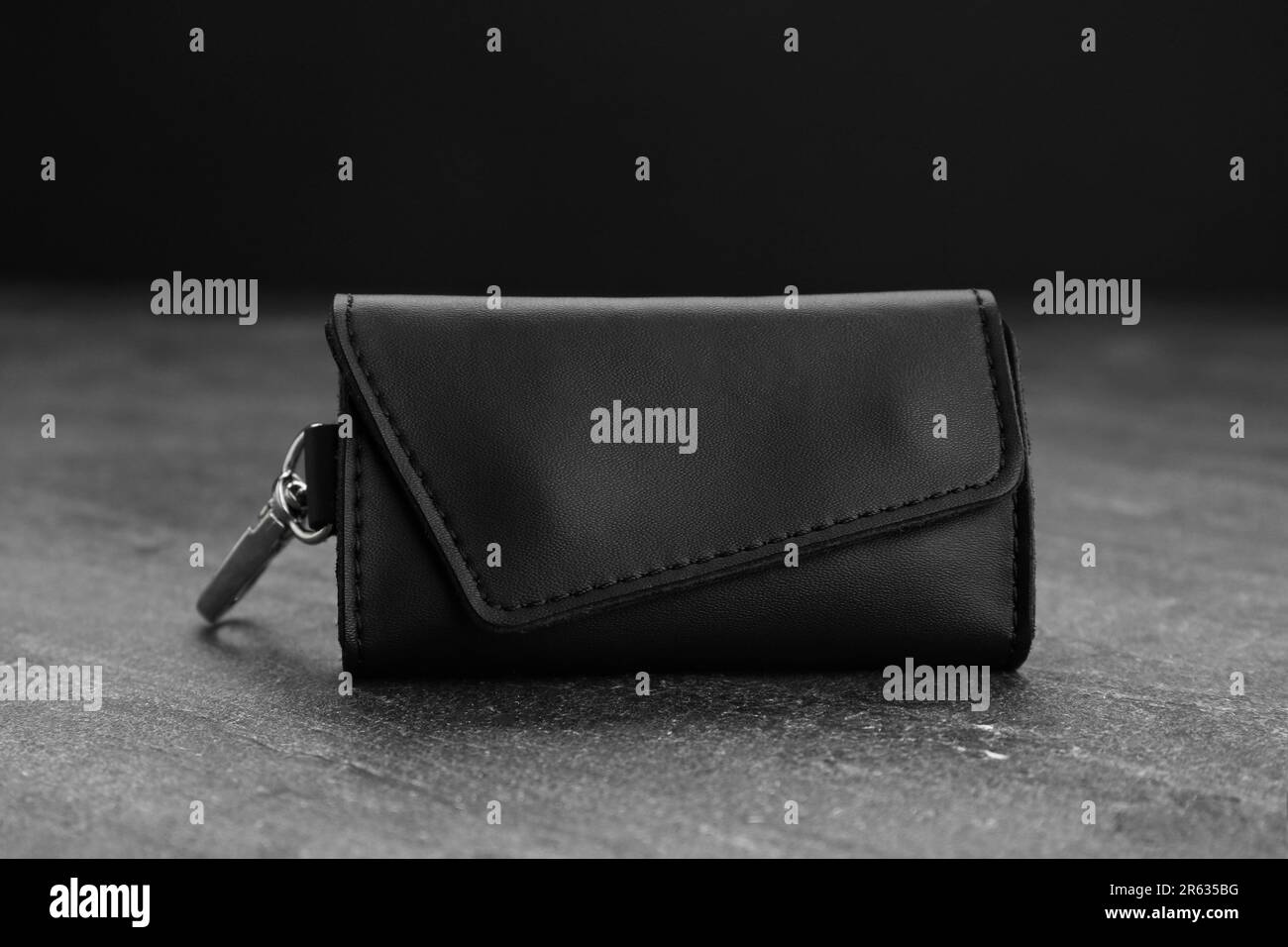 Stylish leather keys holder on grey table, closeup Stock Photo