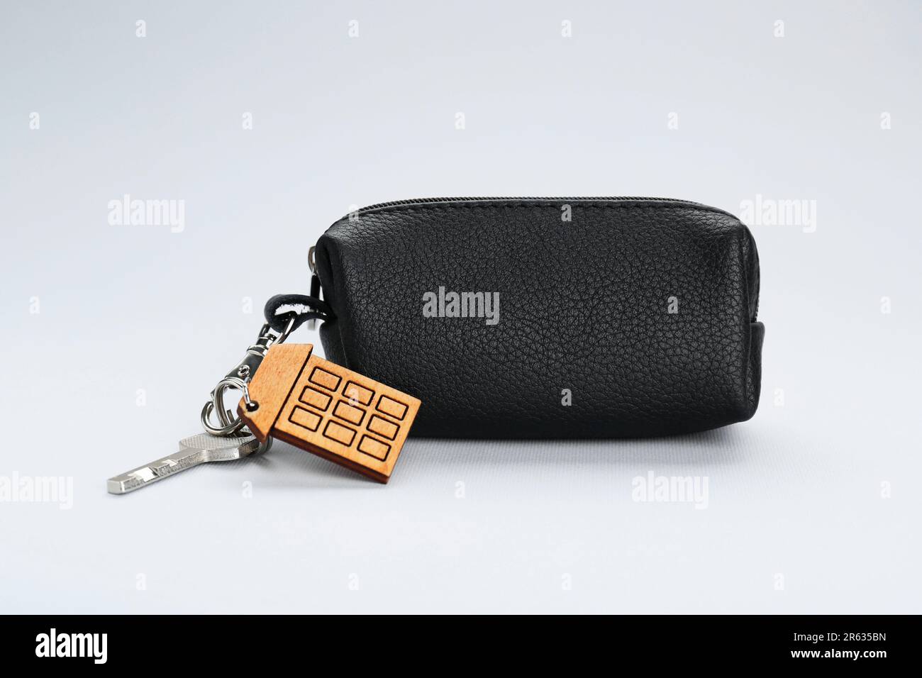 Leather case with keys on light grey background Stock Photo