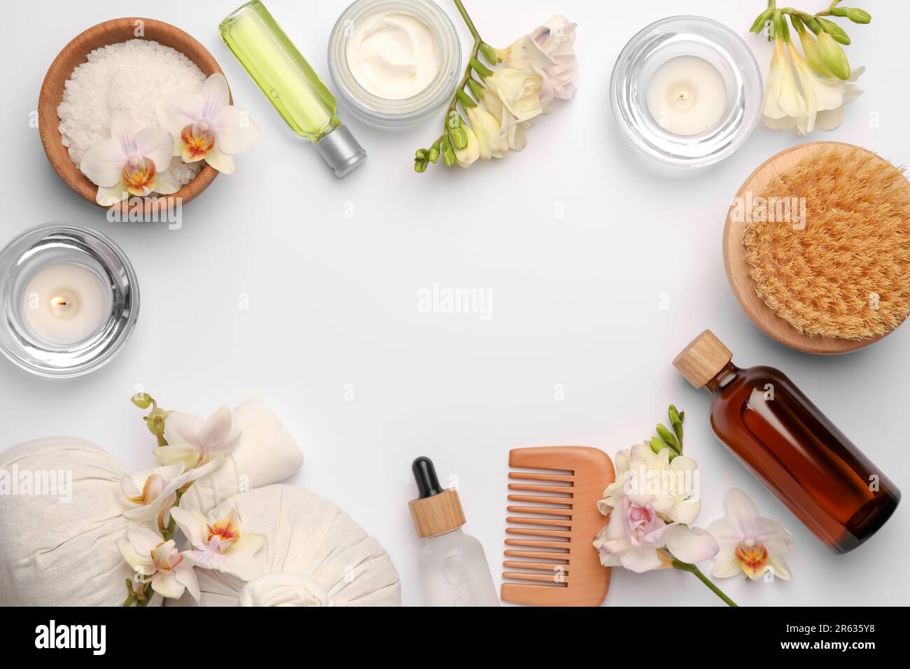 Flat lay composition with different spa products on white background ...