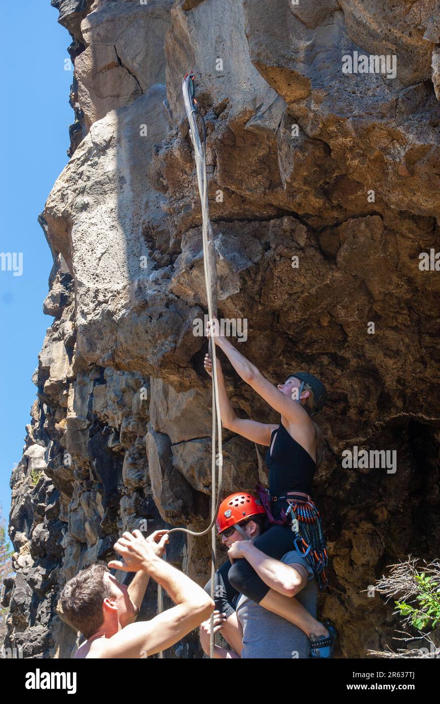 Climbing team being creative clipping a bolt. Tieton Canyon, Washington