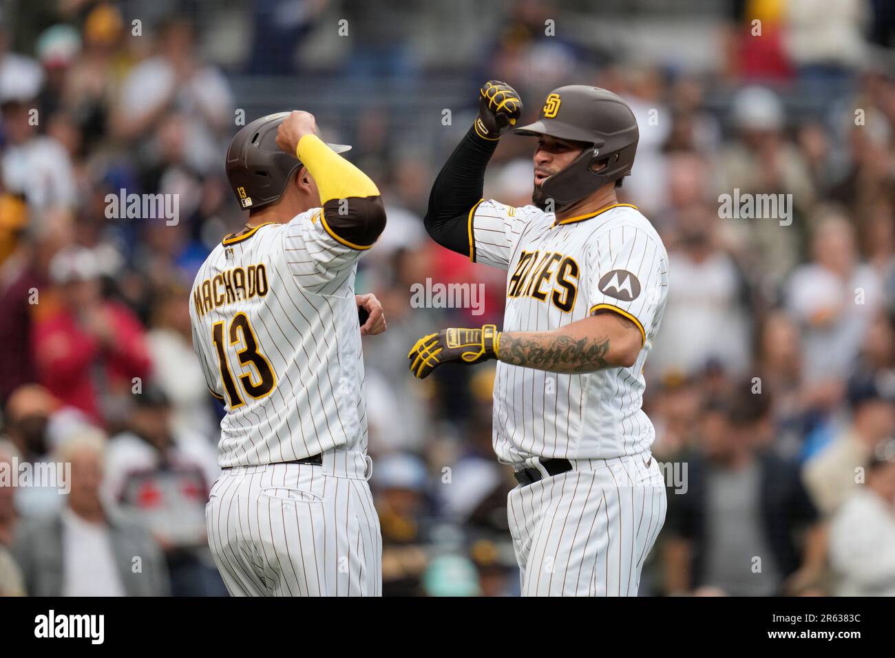 San Diego Padres' Gary Sanchez, right, is greeted by third base coach Matt  Williams after hitting a two-run home run during the second inning of a  baseball game against the Chicago Cubs