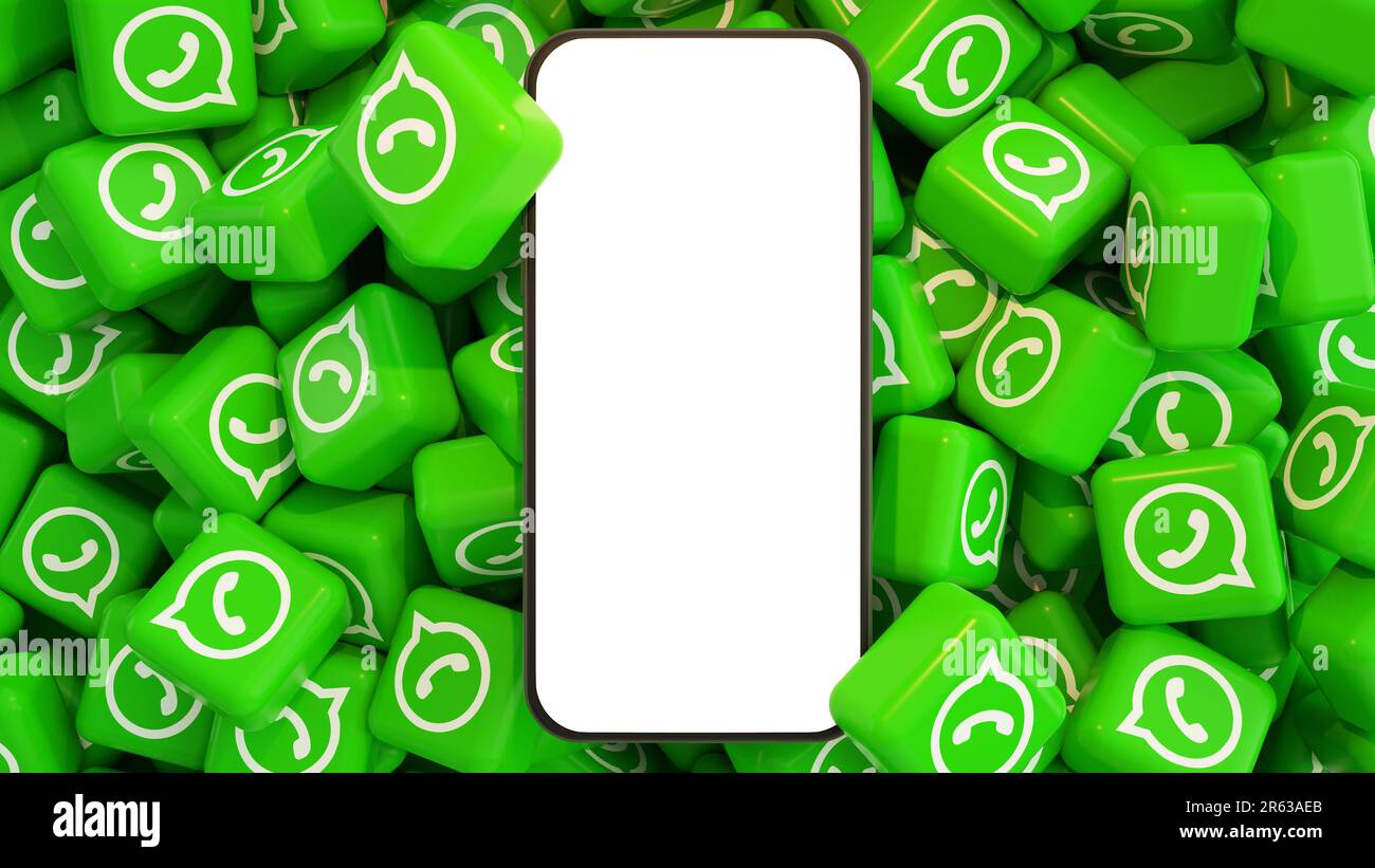 3D rendering of mobile phone with blank screen lying on top of pile of WhatsApp logos Stock