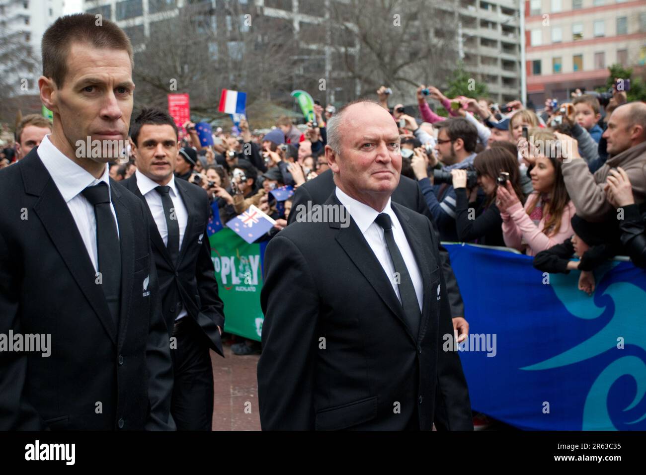 Manager Darren Shand, left, Dan Carter and coach Graham Henry make their way to the stage for the official welcome for the New Zealand Rugby World Cup Team, Aotea Square, Auckland, New Zealand, Saturday, September 03, 2011. Stock Photo