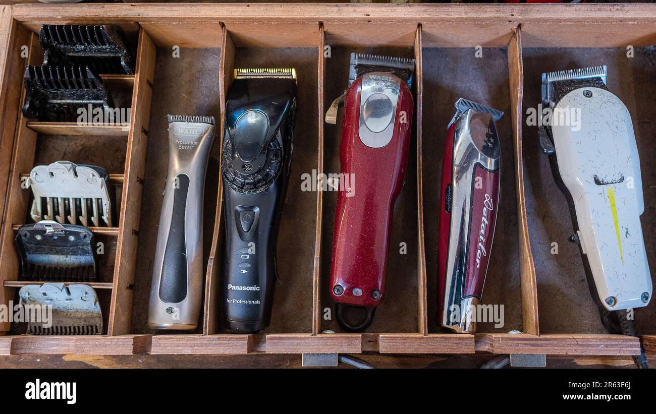 A drawer full of assorted haircutting implements and trimmers Stock