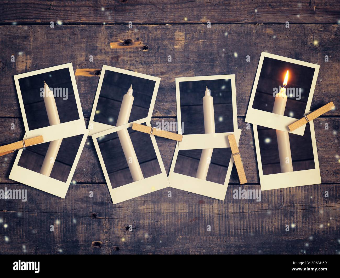 Old instant photograph with four candles on a rustic wooden background, Advent concept background retro film stylized Stock Photo