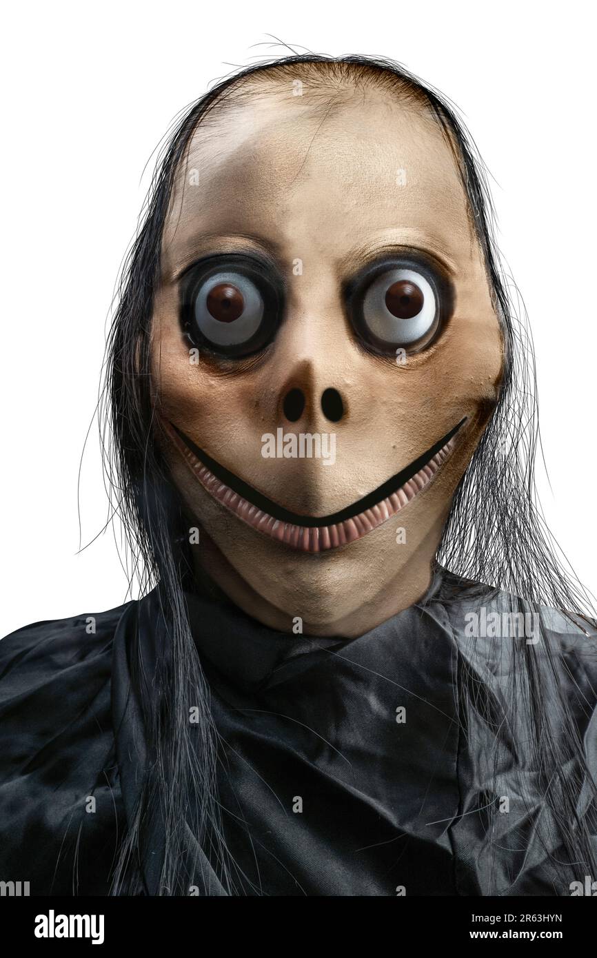 Scary Momo standing behind the wall in the dark background. Scary face for  Halloween. Halloween concept Stock Photo - Alamy