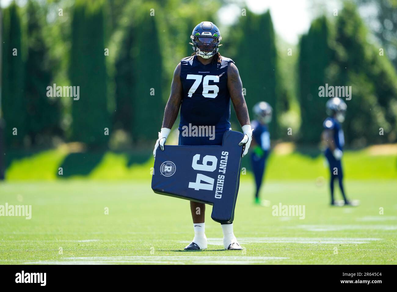 Seattle Seahawks center Joey Hunt (62) and offensive tackle Jalen McKenzie ( 76) run a drill during the NFL football team's training camp, Wednesday,  Aug. 9, 2023, in Renton, Wash. (AP Photo/Lindsey Wasson