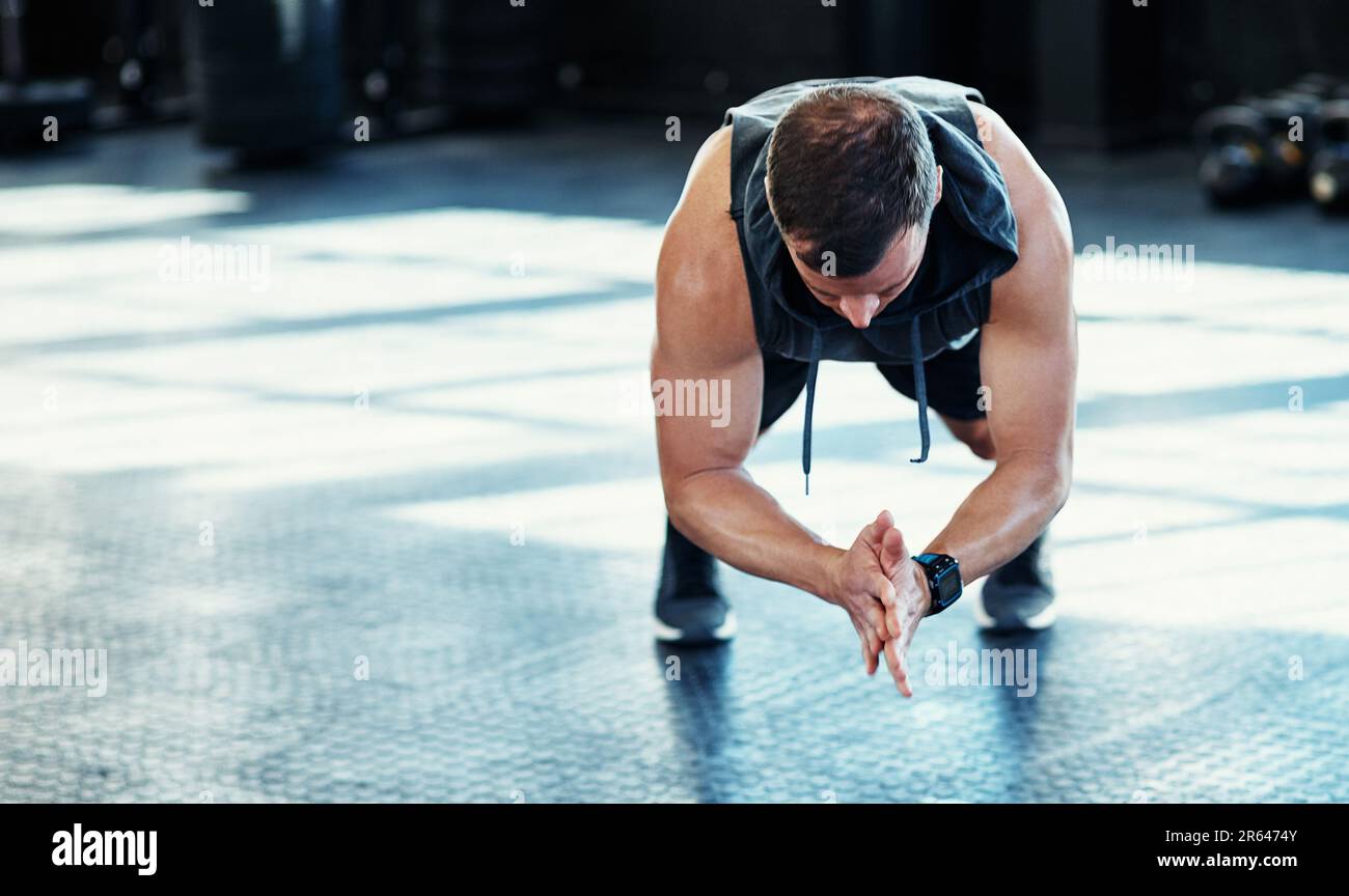 Just keep going and dont give up. a young man doing push ups in a gym