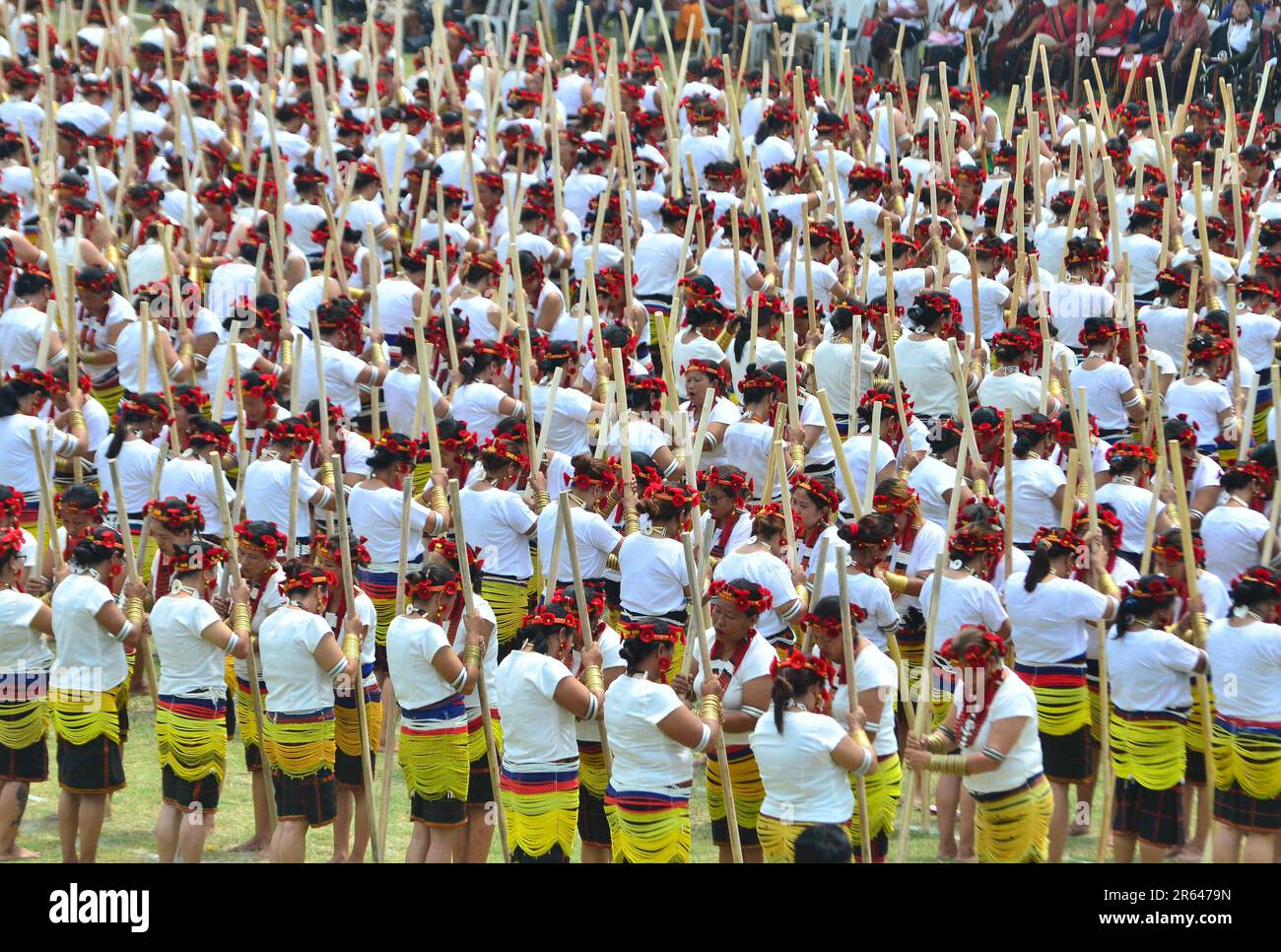 Chumoukedima, India. 07th June, 2023. Dimapur, India: June 07, 2023: Sümi women's perform a traditional Sümi rice pounding folk song called ‘Thishole' during Western Sumi Torimi Hoho Silver Jubilee at Thilixü Village in Chumoukedima district, India north eastern state of Nagaland. Altogether 1400 Sülimis perform their traditional rice pounding folk song to mark their 25th Anniversary. Credit: Caisii Mao/Alamy Live News Stock Photo