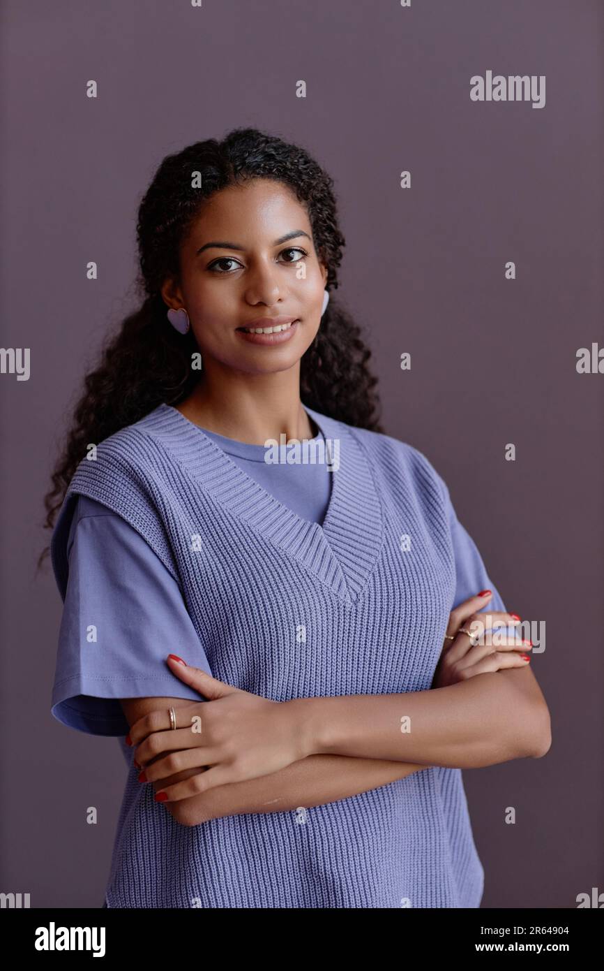 Minimal waist up portrait of candid black young woman smiling at camera ...