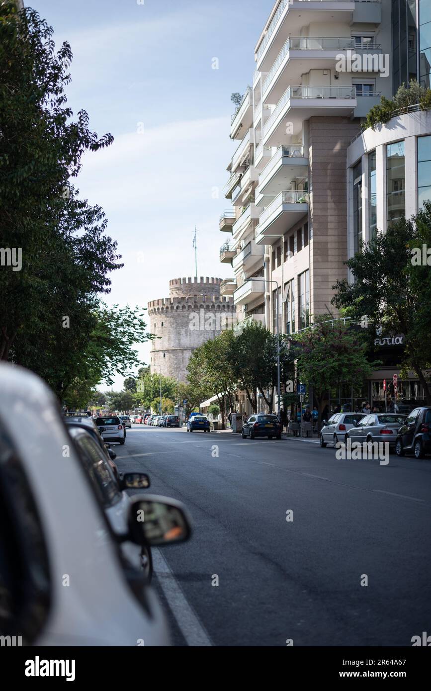 A street view urban street Thessaloniki with the White Tower on the end Stock Photo