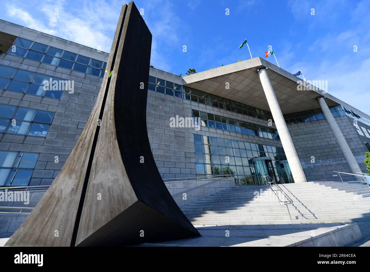 Wooden Sculpture 'Wood Quay' by Michael Warren outside the offices of
