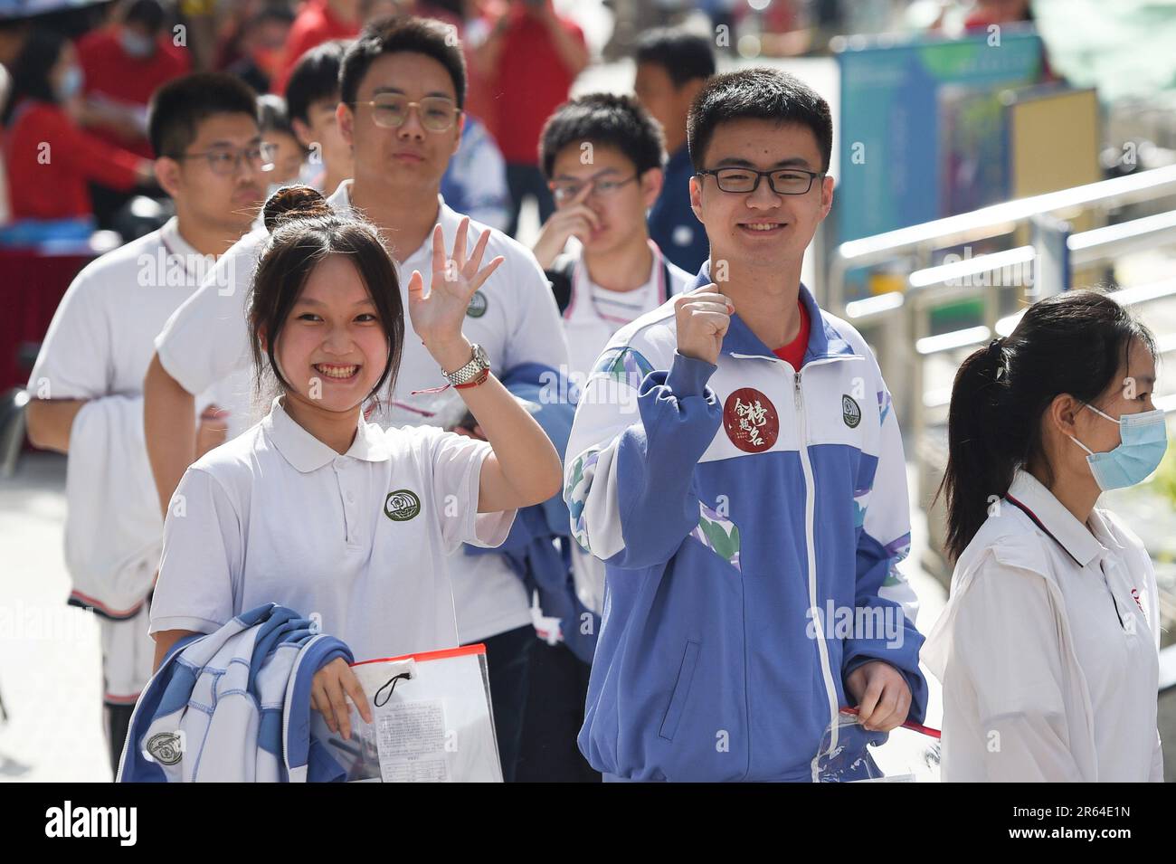 Beijing, China. 7th June, 2023. Examinees queue up to enter an exam ...