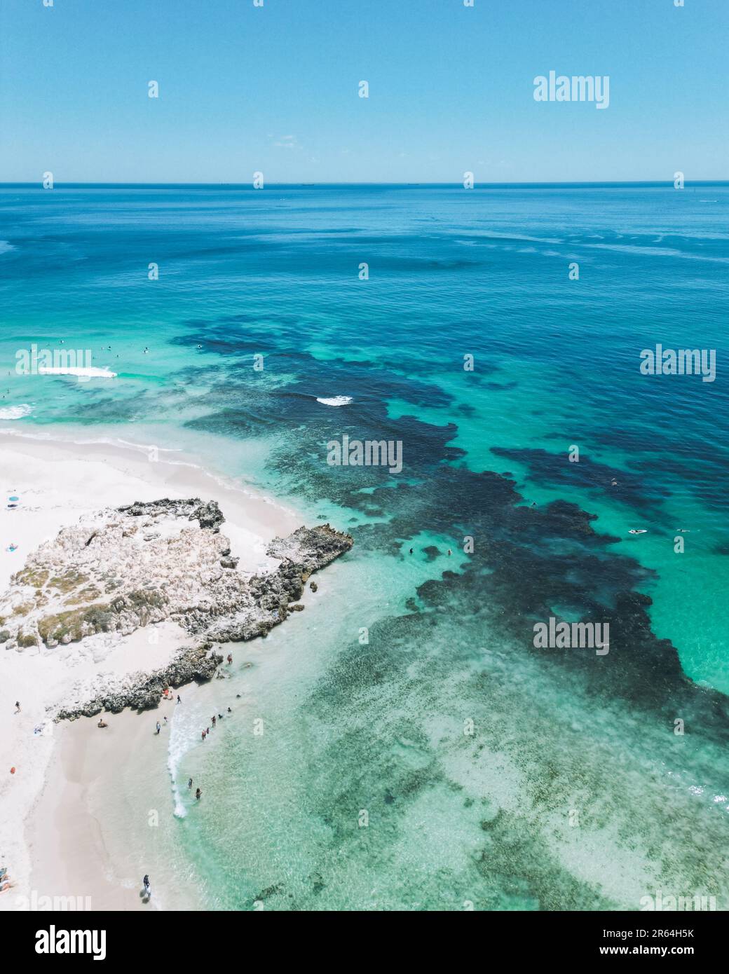 An aerial view of a sandy beach of Perth Trigg and ocean reef in