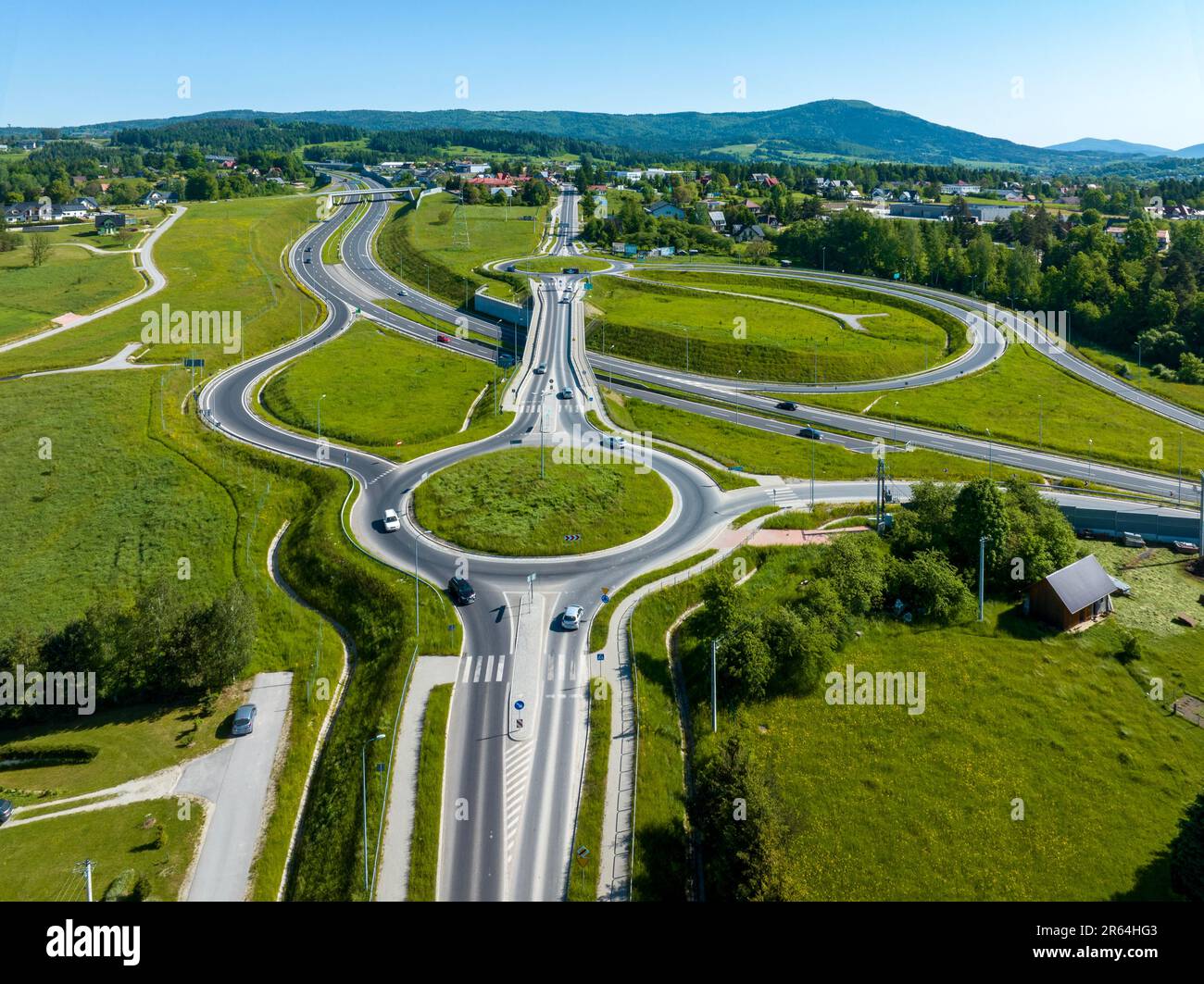 New highway junction in Poland on national road no 7, E77, called Zakopianka.  Overpass crossroad with traffic circles, slip ramps and viaducts near R Stock Photo