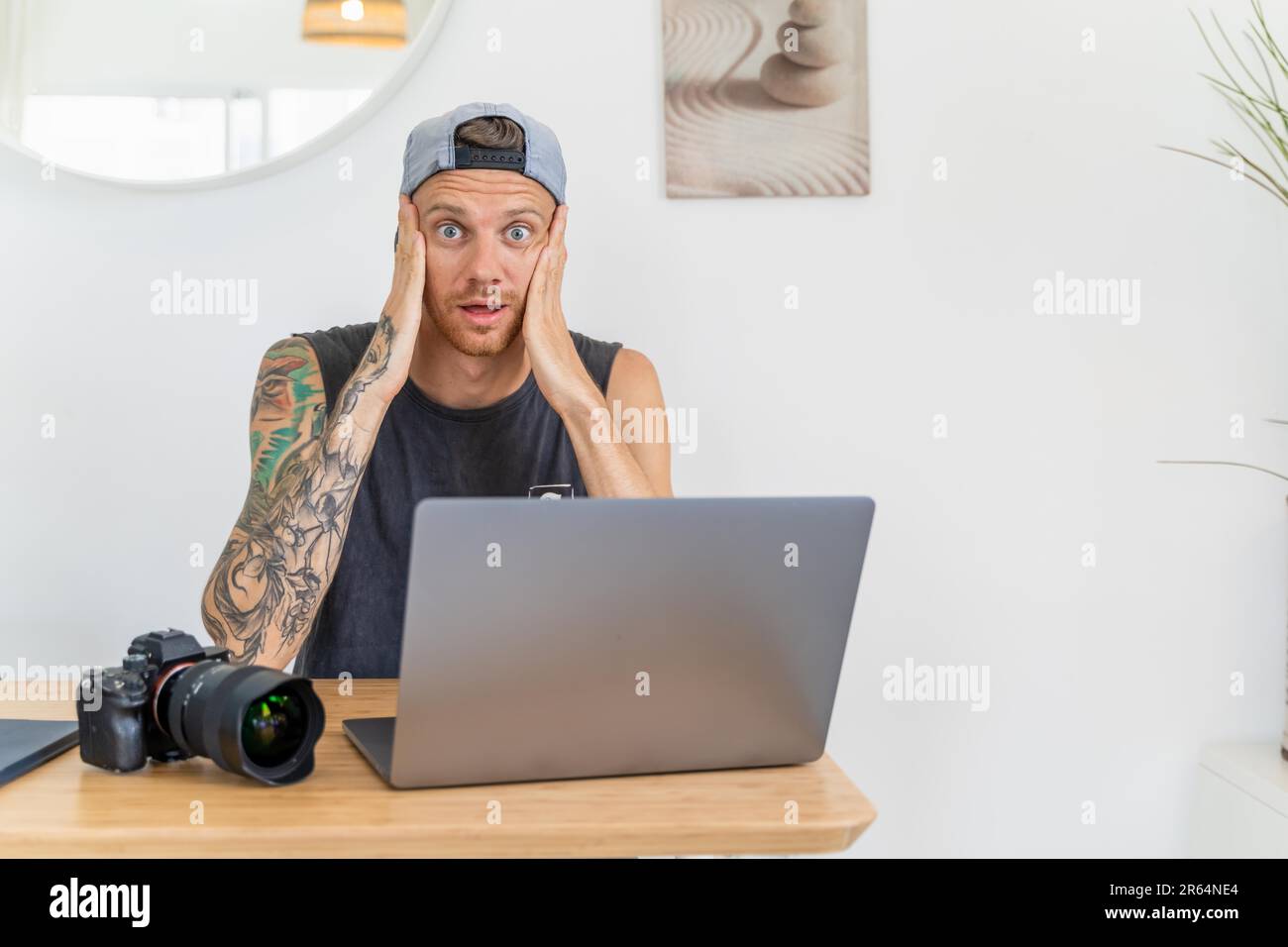A photographer on laptop lost camera files Stock Photo