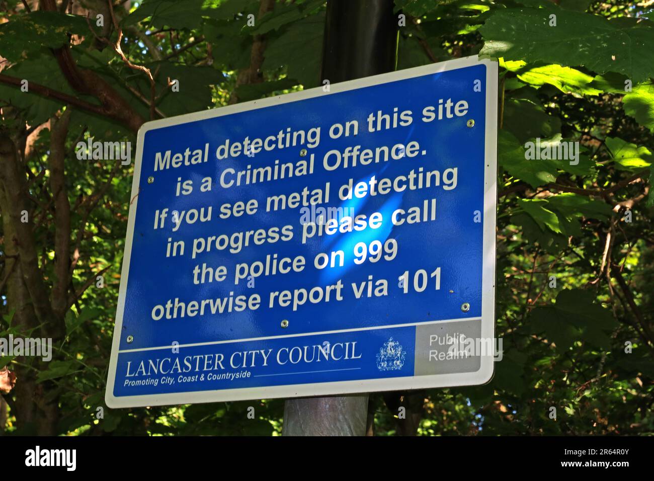 Lancaster City Council, Public Realm, No metal detecting sign, criminal offence - In city centre close to Priory Church of Saint Mary Stock Photo