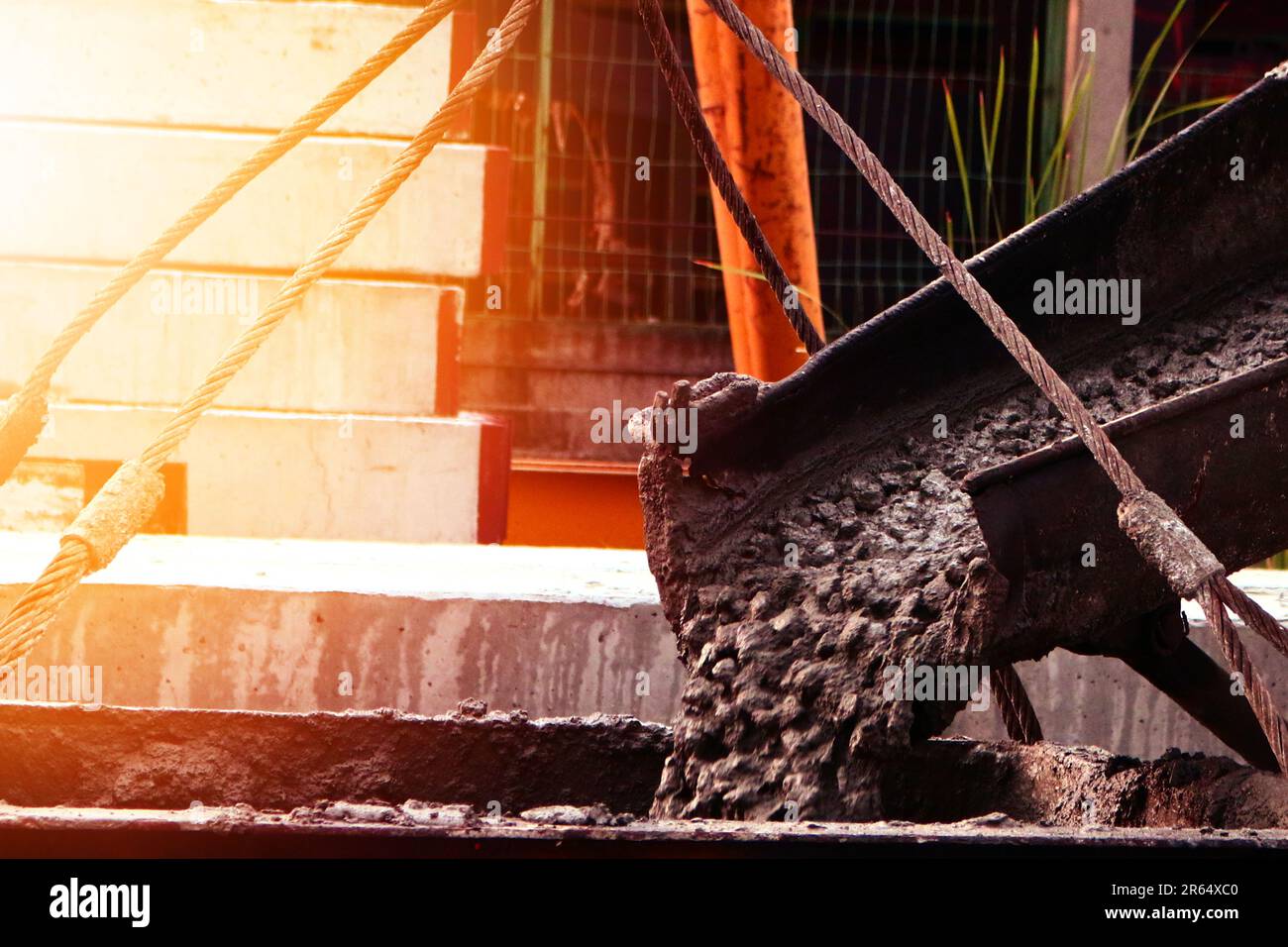 Mixer truck pouring cement or concrete at construction site Stock Photo ...