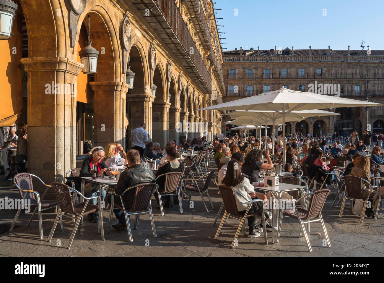 Salamanca Spain, view in summer of people relaxing at cafe tables in the Plaza Mayor in the historic Spanish city of Salamanca, Castilla Y Leon Stock Photo