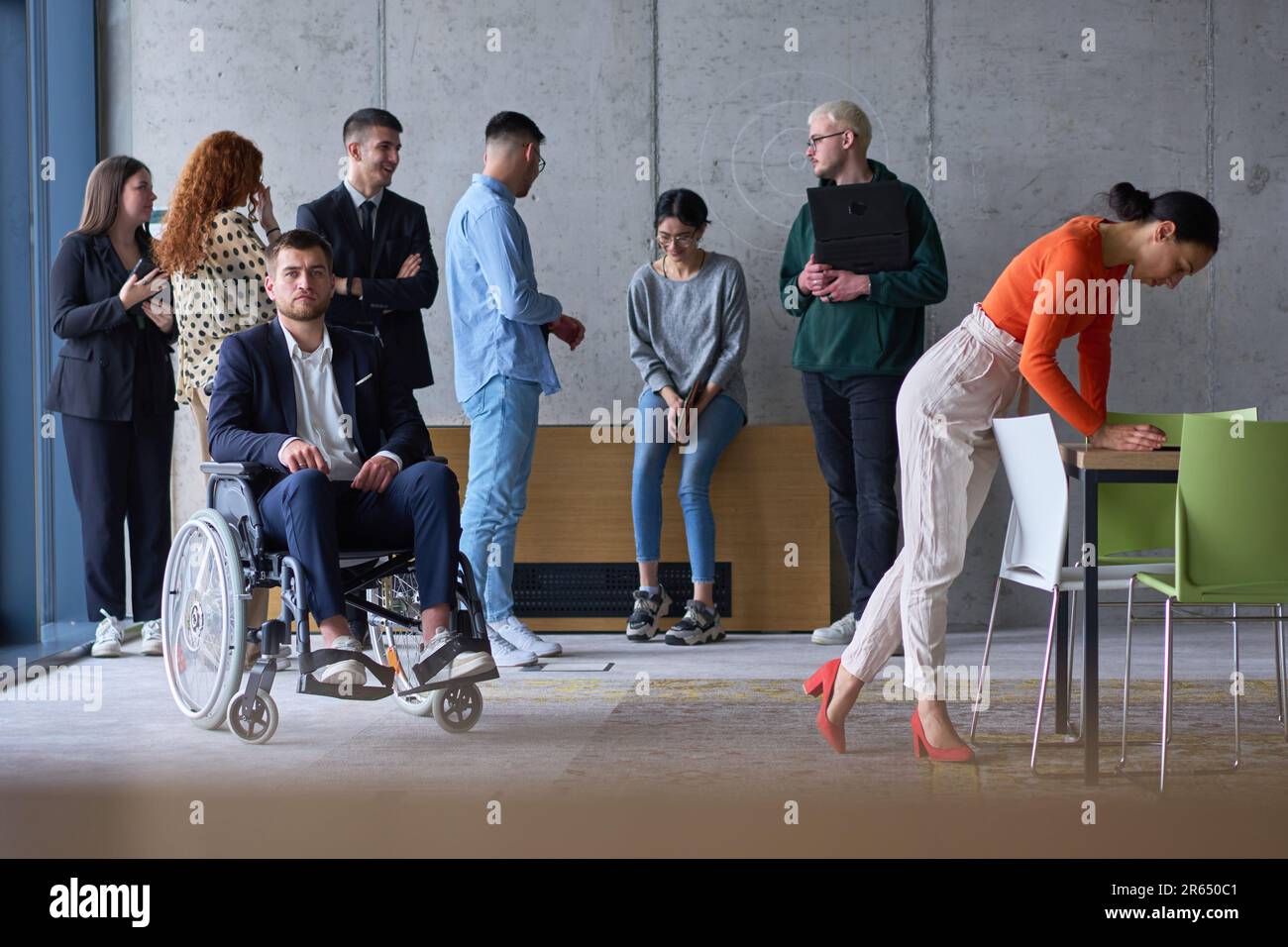 Diverse group of business people, including a businessman in a ...