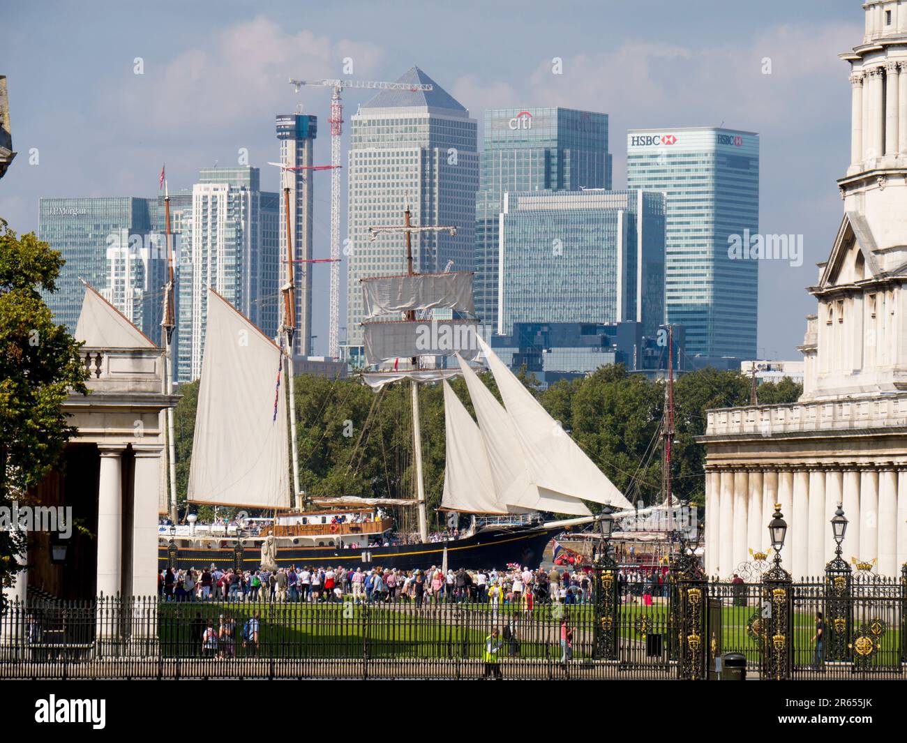 Tall Ship sails past Greenwich Royal naval College with Canary Wharf in background Stock Photo