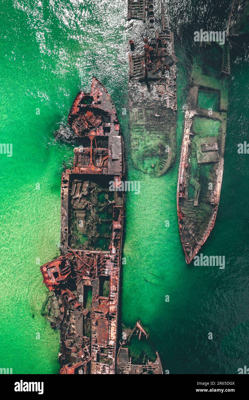 This is an aerial shot of the visible wrecks. Brisbane, Australia: PICTURES SHOW how tourists Down Under are flocking to feast their eyes on a ship gr Stock Photo