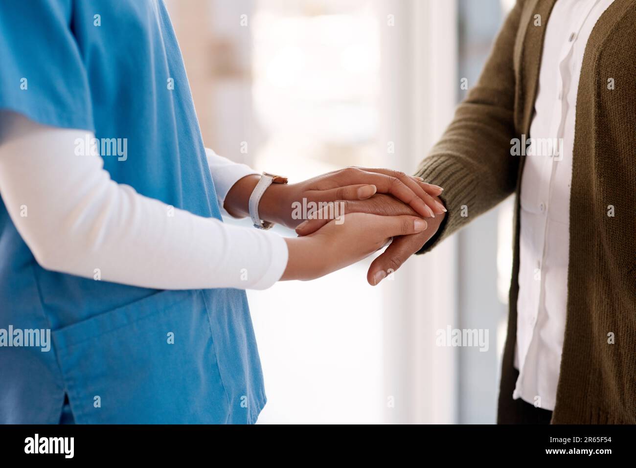 Support, holding hands and nurse with senior woman for empathy ...
