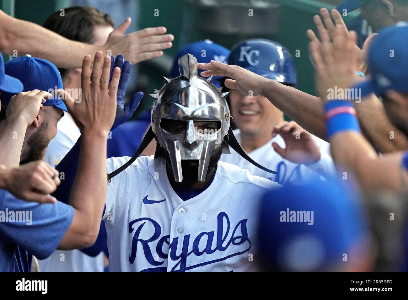 FILE - Kansas City Royals' Jackie Bradley Jr., wearing a gladiator style  helmet, is greeted in the dugout after hitting a two-run home run against  the Detroit Tigers Monday, May 22, 2023