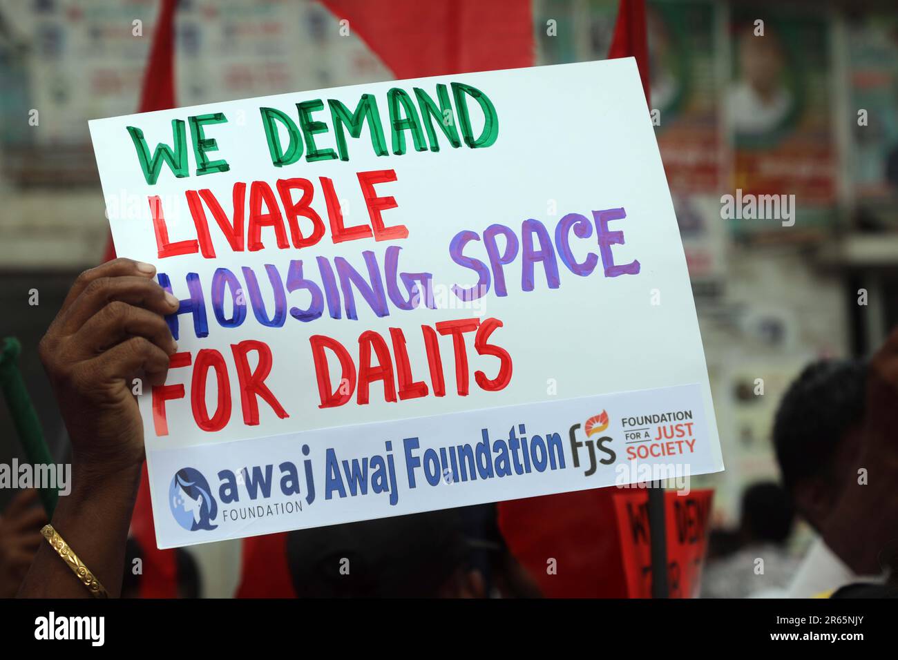 DHAKA, BANGLADESH - JUNE 2: Dalit and excluded community members hold signs and chant as they participate in a protest demanding human rights in front Stock Photo