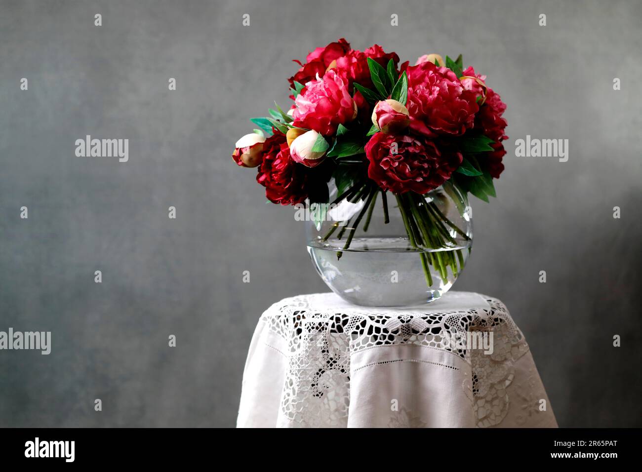 Still Life with Peonies in a glass vase Stock Photo
