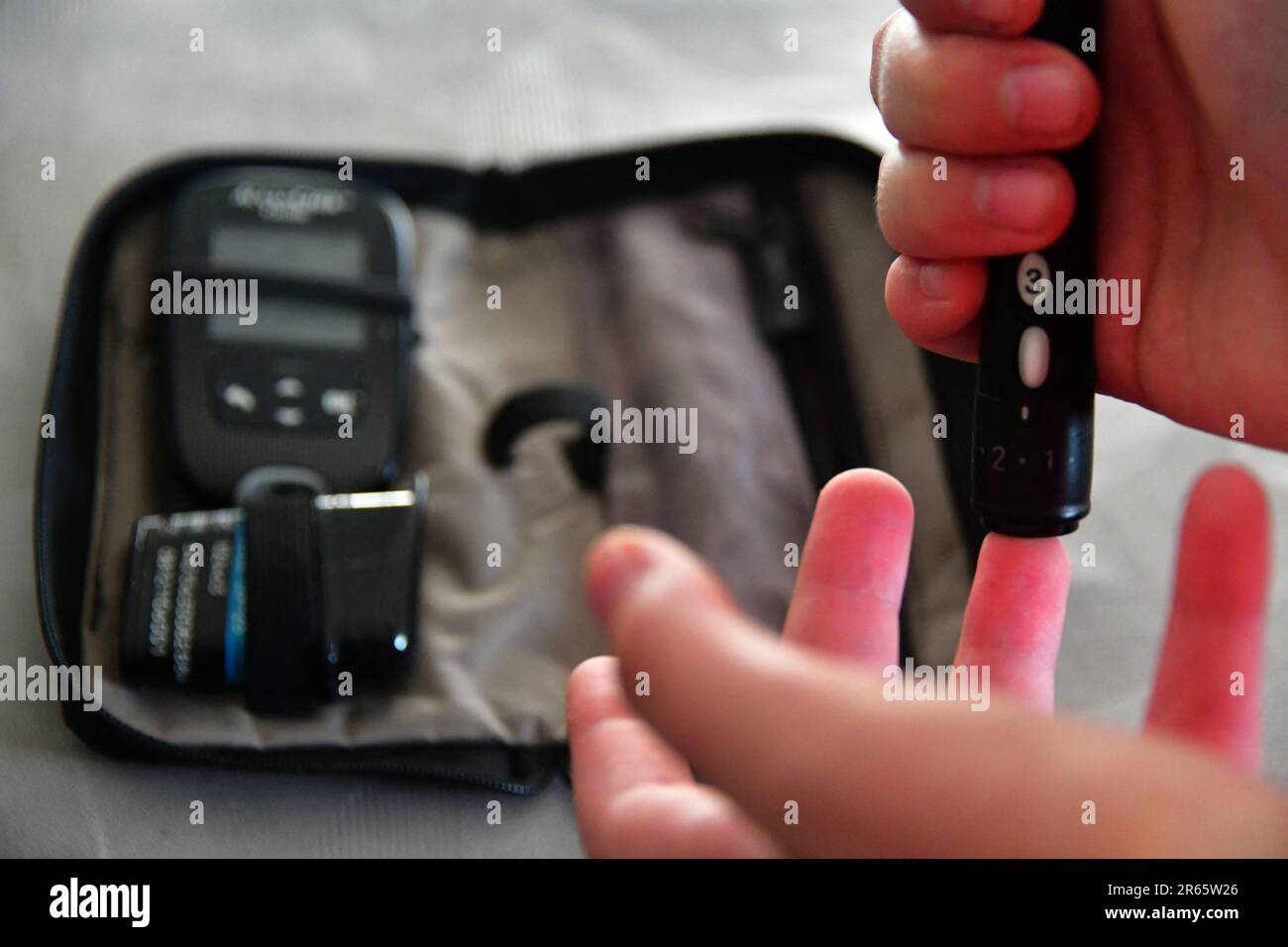 Peille, France. 03rd June, 2023. A young diabetic woman injects herself