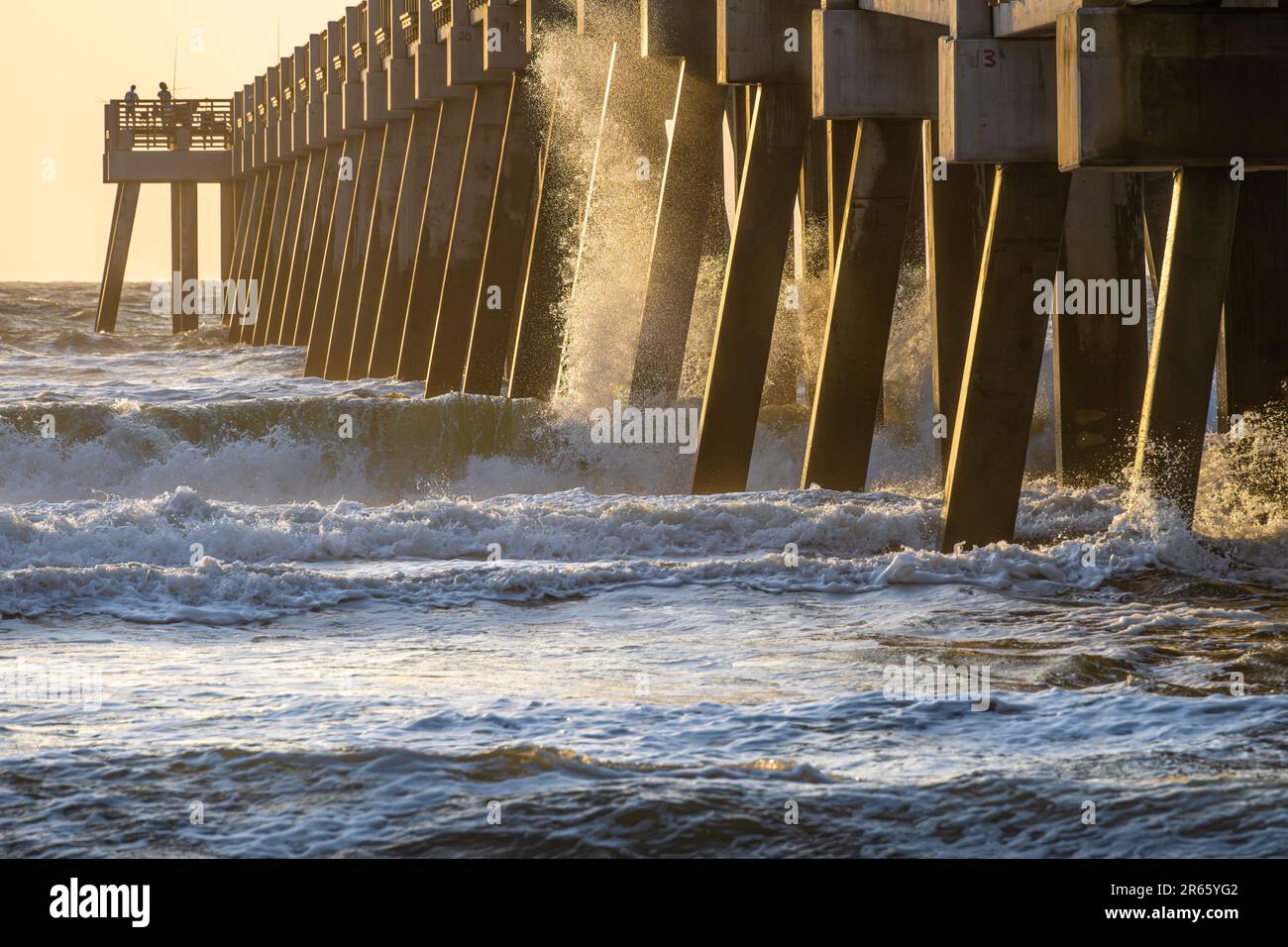 Sunrise saltwater fishing at the Jacksonville Beach Pier in Northeast Florida. (USA) Stock Photo