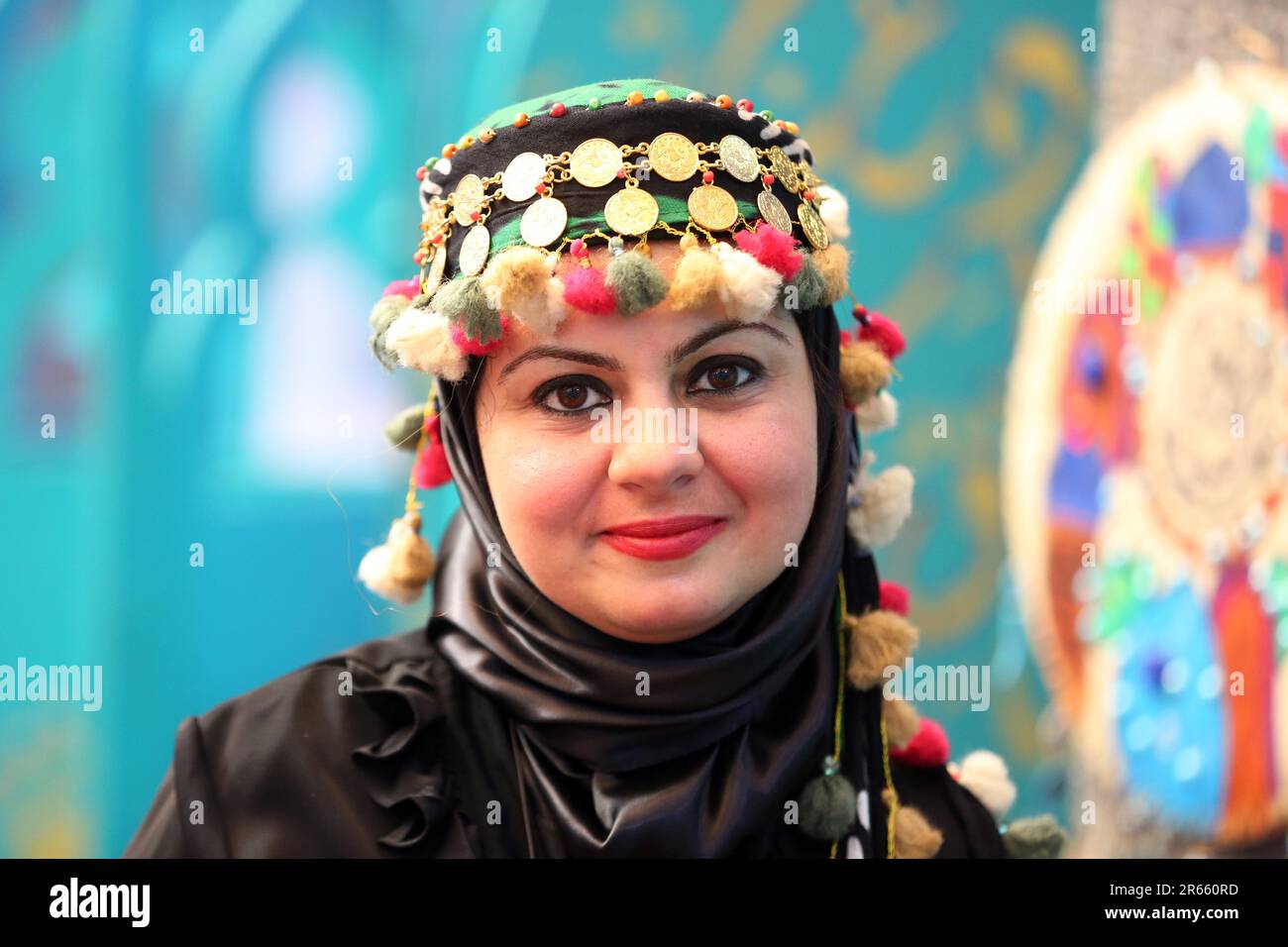 Baghdad, Iraq. 7th June, 2023. A woman in traditional costume is