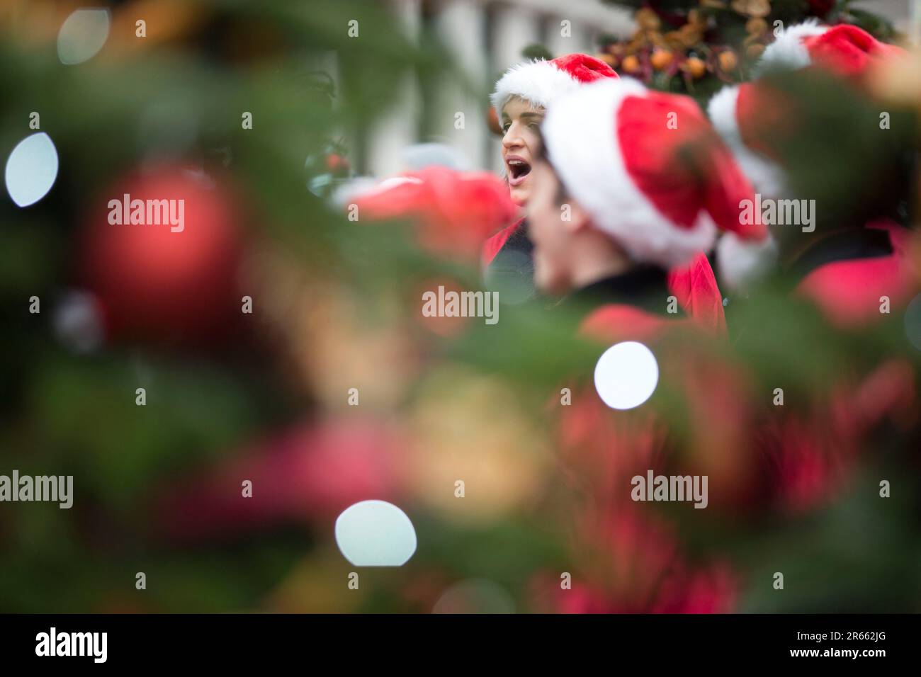 Christmassy decorations and outfits are seen in Covent Garden, central London. Stock Photo